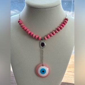 A hand made piece. Pink evil eye necklace for women or teens.